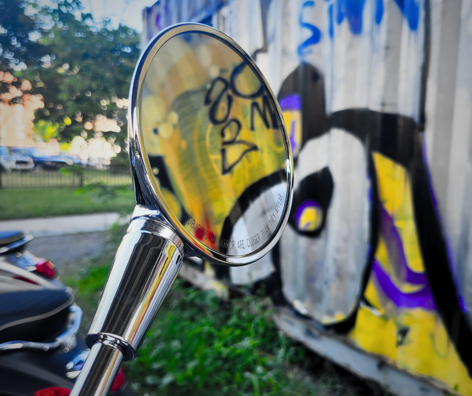 close up view of one of the mirrors of a Vespa