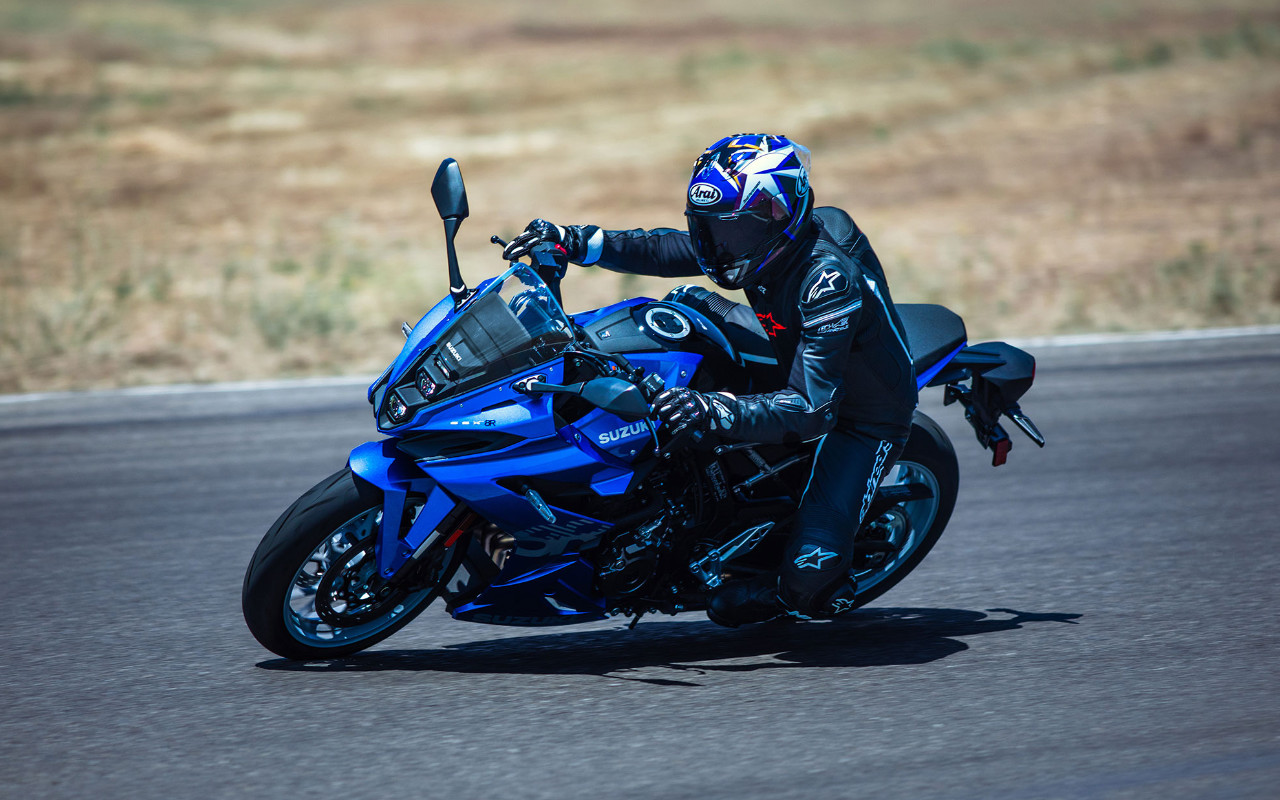side view of a 2024 Suzuki GSX-8R and its driver on a race track