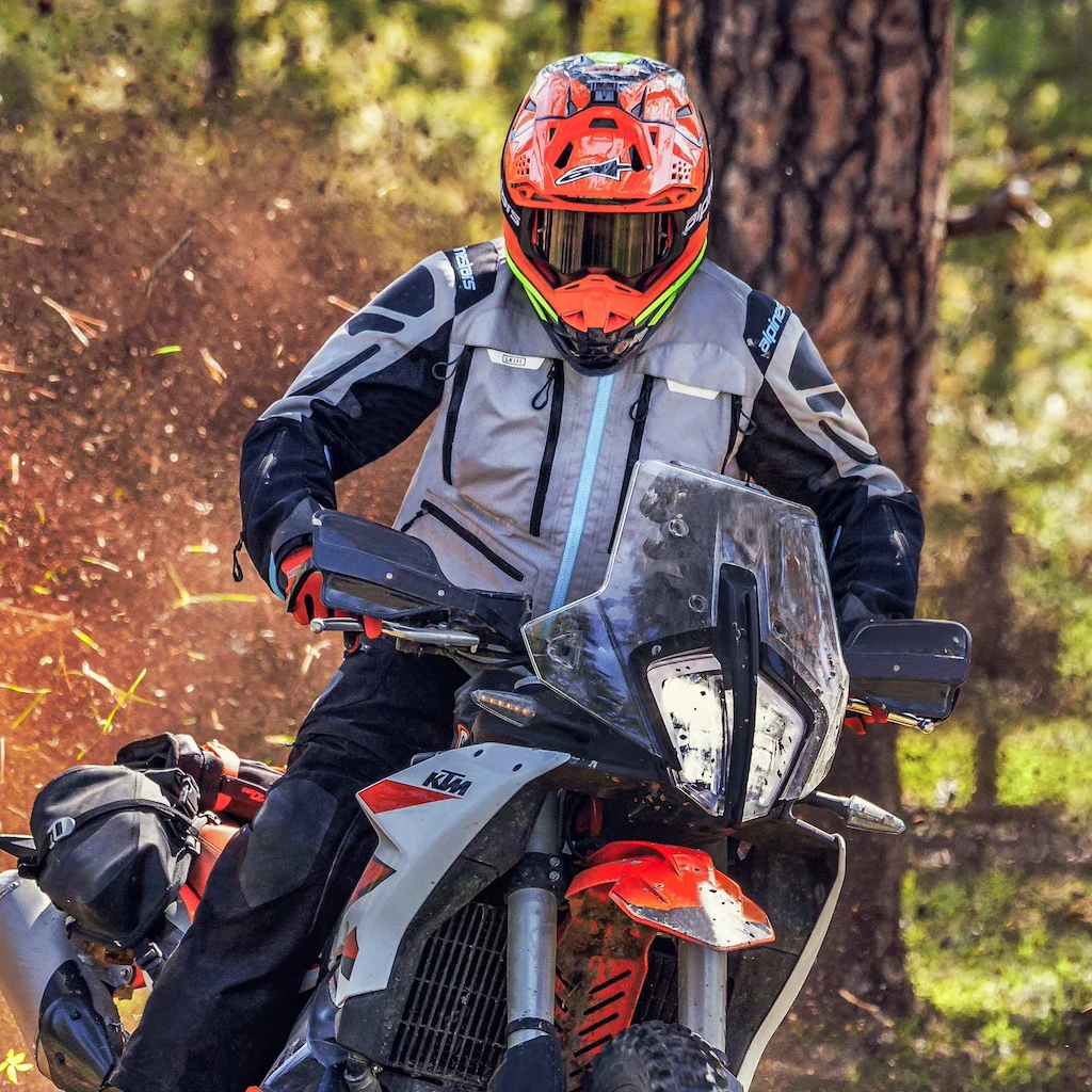 Motorcyclist with his motorcycle clothing according to the weather conditions.