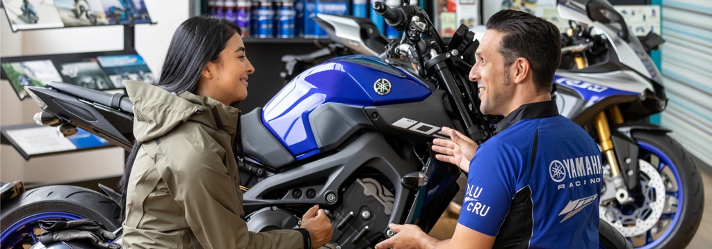 Customer buying experience for a motorcycle at a dealership.