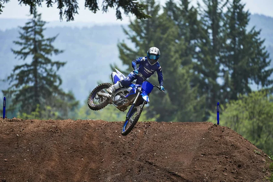 Motorcyclist performing a jump with a Yamaha YZ250FX motorcycle.